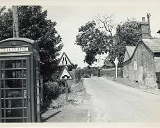 LHG01_0024 View from Old Warwick Road down Mill Lane. Bill Byerly (on bridge) was the road sweeper for Lapworth and lived in Bird in Hand Cottages down the steps on the...