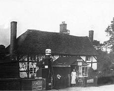 Picture7 Foxbrook Cottage. Rose Wall standing outside the 'Shed Shop' with the only petrol pump between Warwick and Hockley Heath