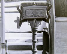 P1070005 Detail of lectern from 1899 interior photo. This lectern is still in the church though its base has been cut off (for a short vicar?) and now stands on a plinth...
