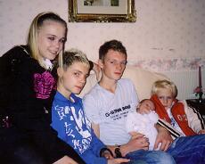 Fisher07 Harriet Stokes, Freddie Stokes, George Stokes and Henry Stokes with baby Charlie Neal. 2009.