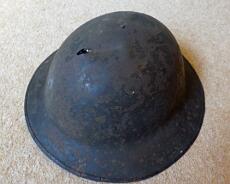 P1070748 Fred Neale's helmet with bullet damage